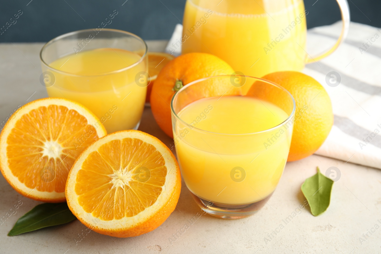 Photo of Composition with orange juice and fresh fruit on table