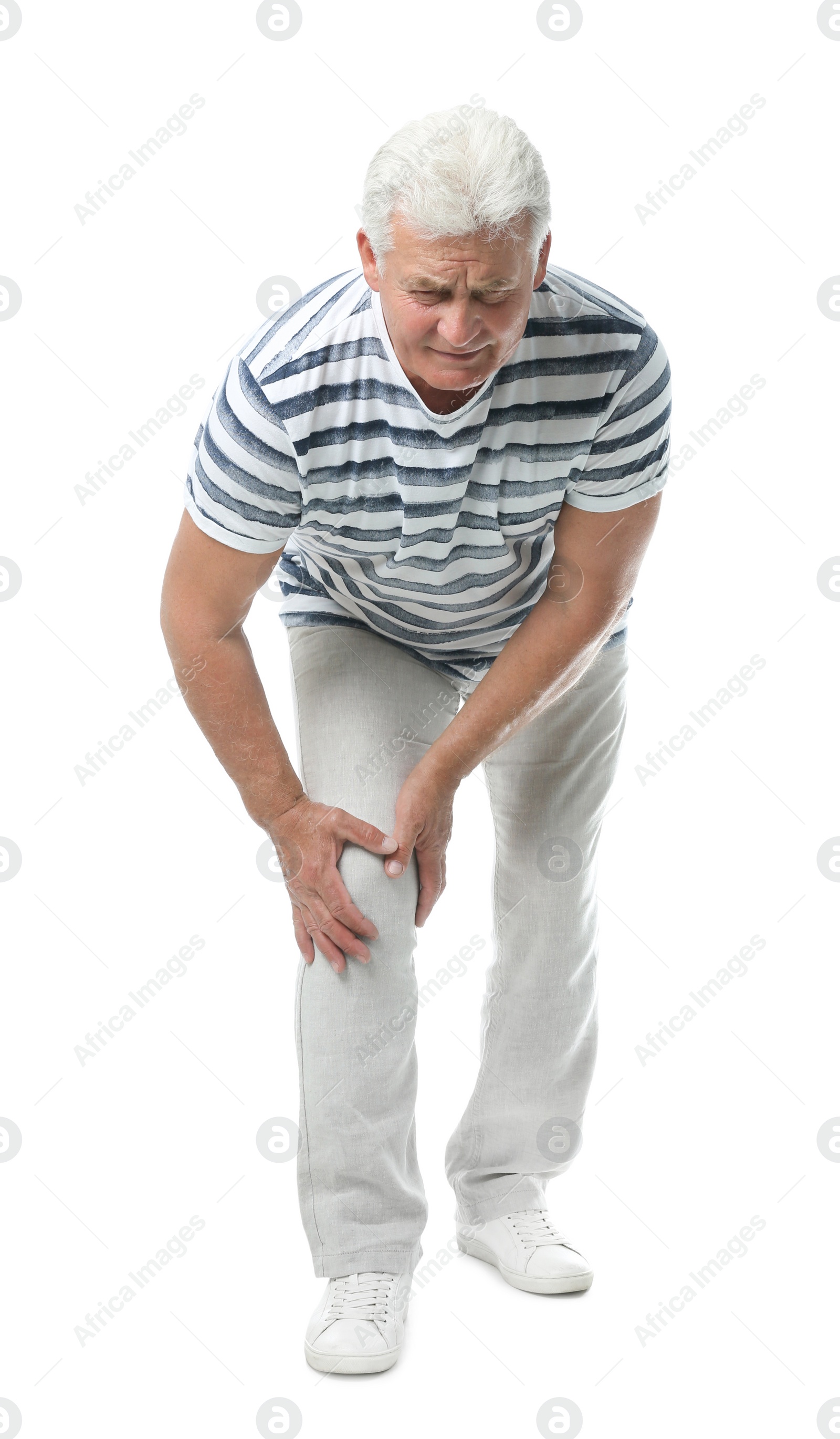 Photo of Full length portrait of senior man having knee problems on white background