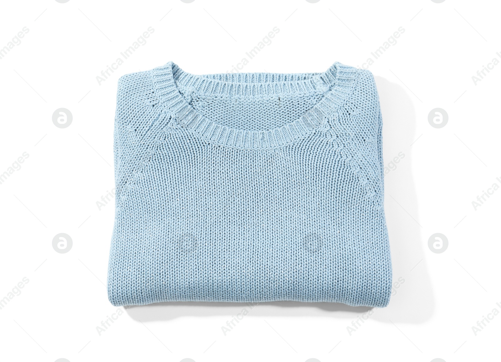 Photo of Folded cozy warm sweater on white background, top view