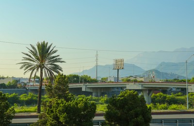 Photo of Picturesque view of city highway near mountains