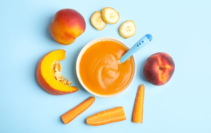 Photo of Flat lay composition with healthy baby food and ingredients on light blue background