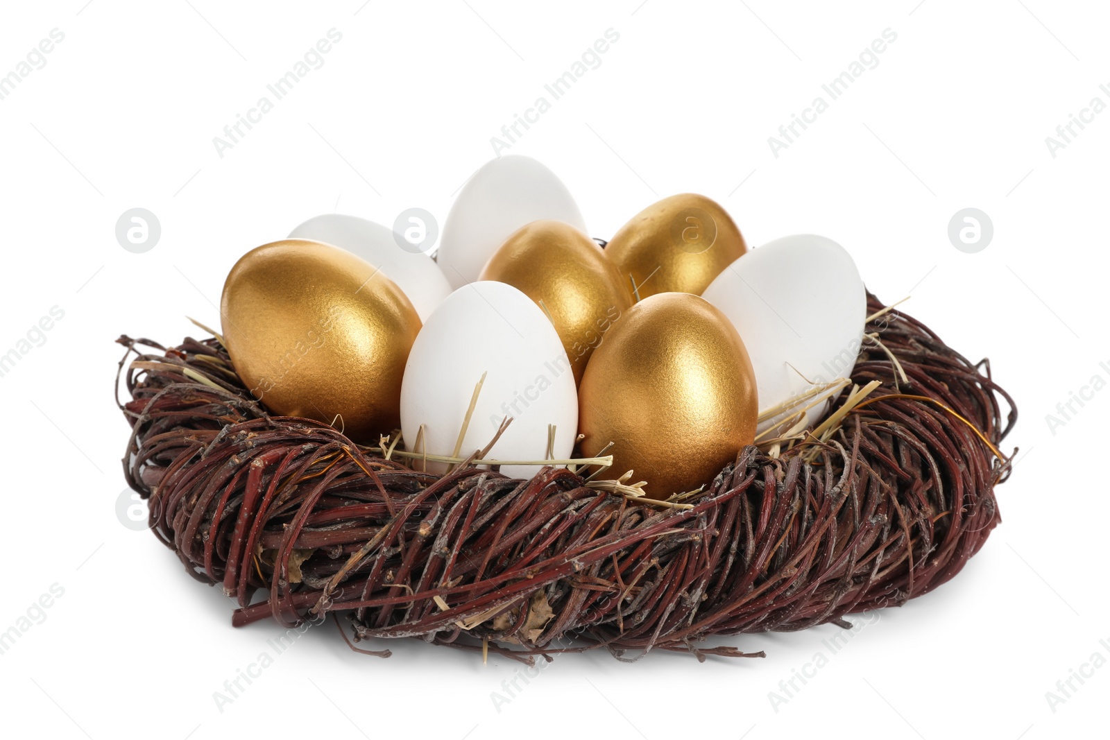 Photo of Nest with golden eggs among ordinary ones on white background