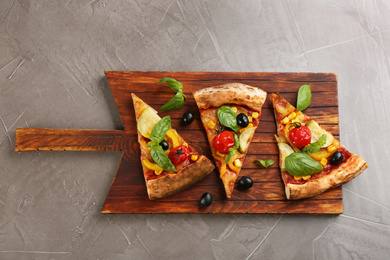 Delicious vegetable pizza on grey table, top view