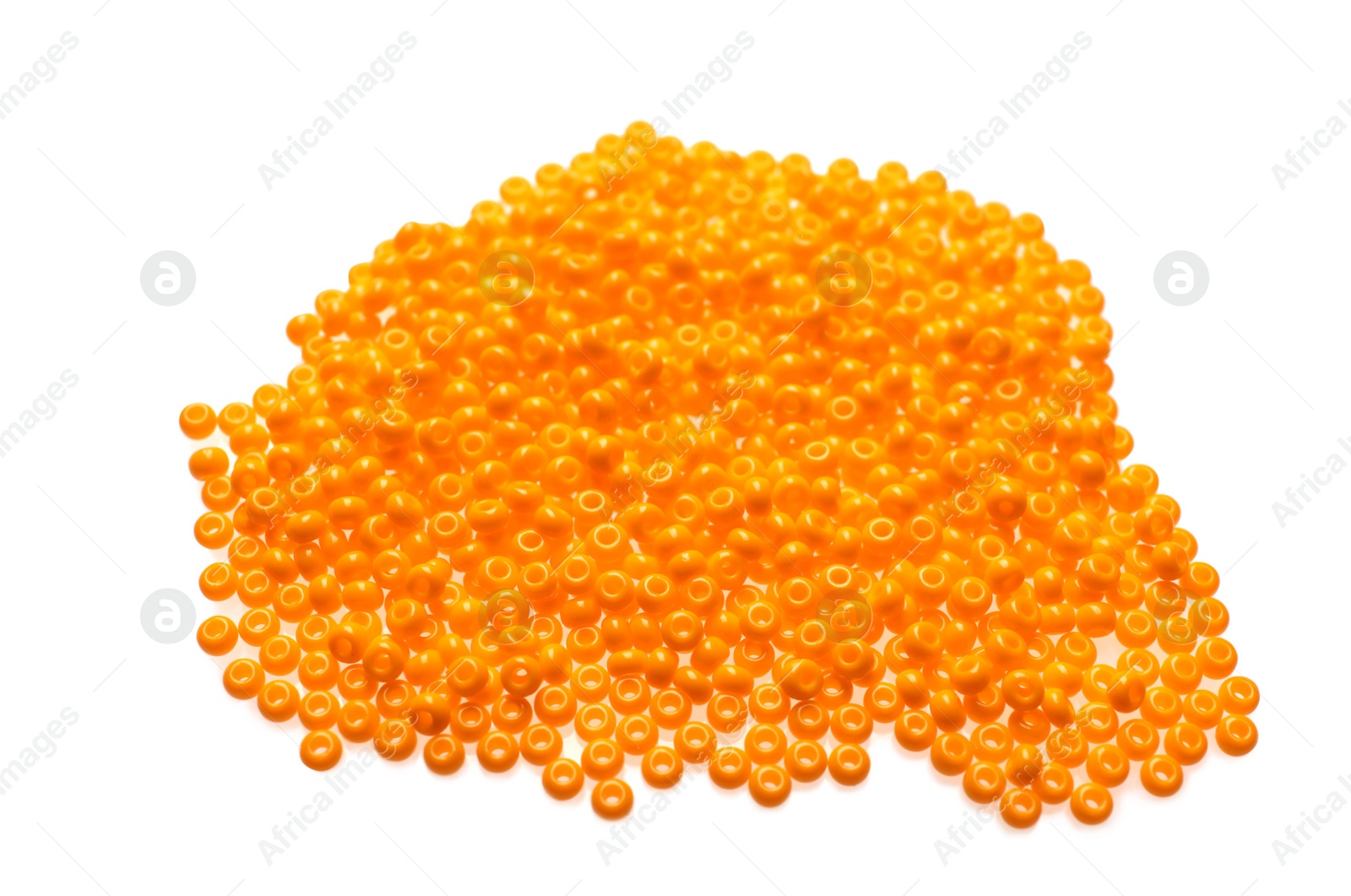 Photo of Pile of orange beads on white background