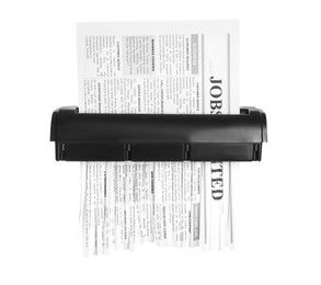 Photo of Destroying newspaper with shredder on white background