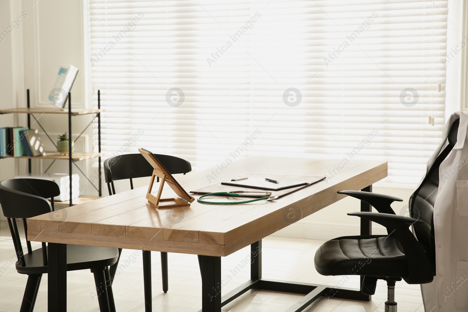 Photo of Modern doctor's workplace in stylish office. Interior design