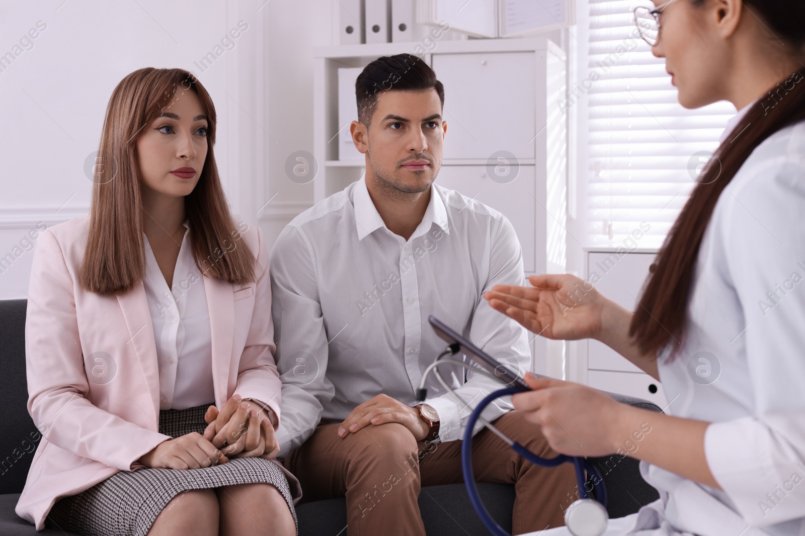 Photo of Couple having appointment with STD specialist in clinic