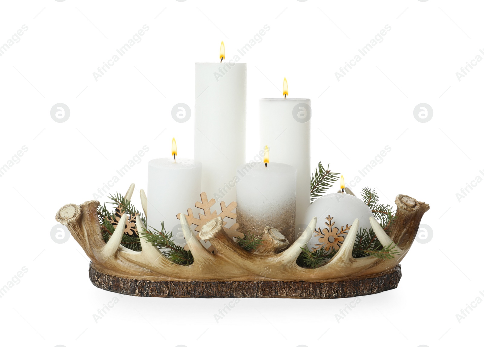 Photo of Beautiful burning candles with Christmas decor in basket on white background