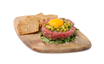Photo of Tasty beef steak tartare served with yolk, pickled cucumber and sliced bread isolated on white