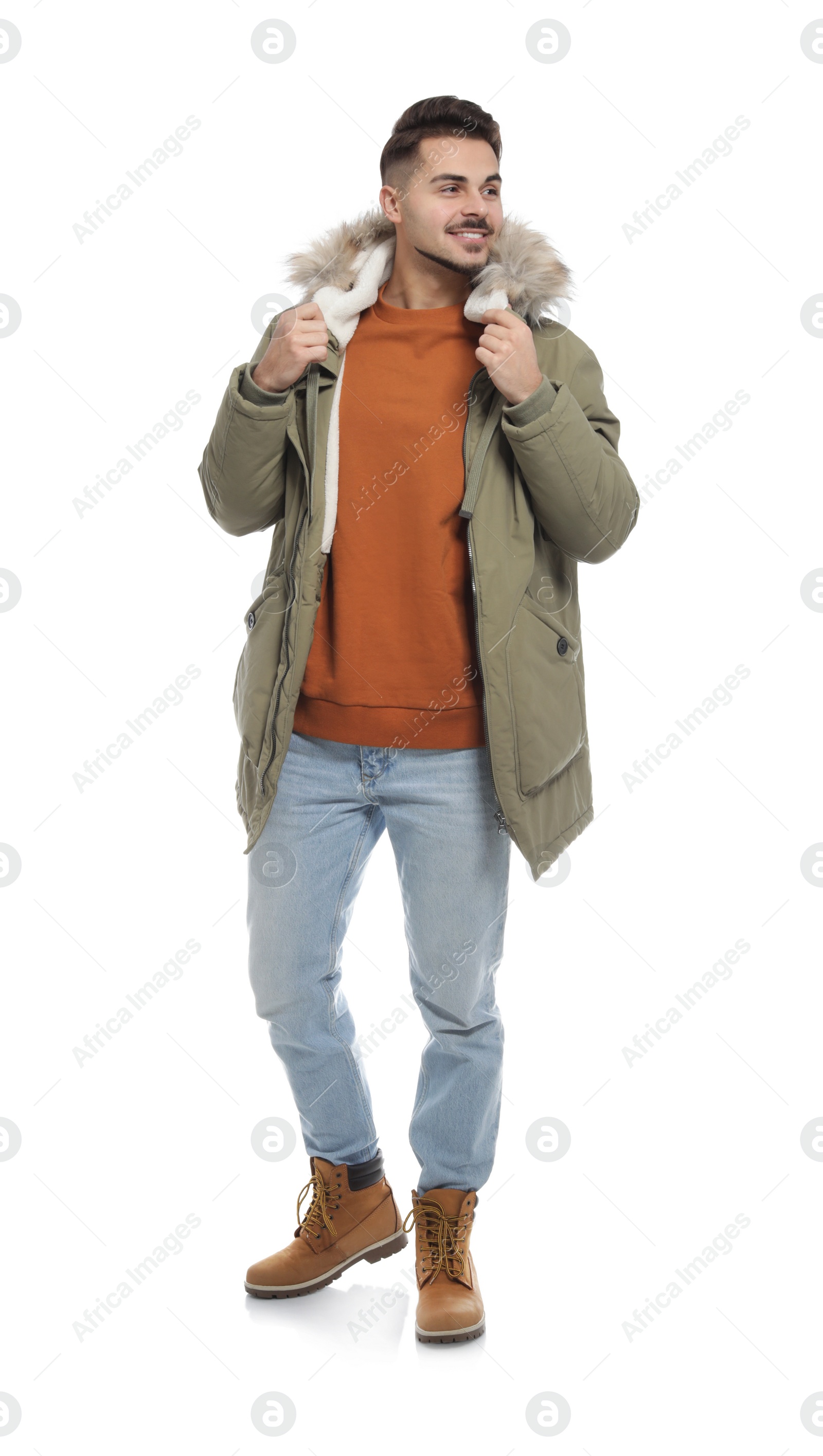 Photo of Young man wearing warm clothes on white background. Ready for winter vacation