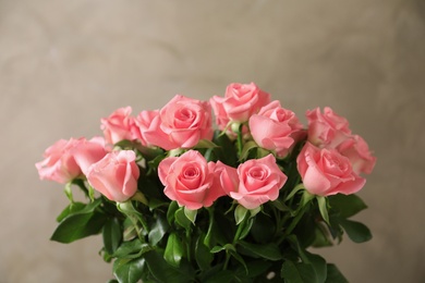 Photo of Bouquet of beautiful roses on blurred background