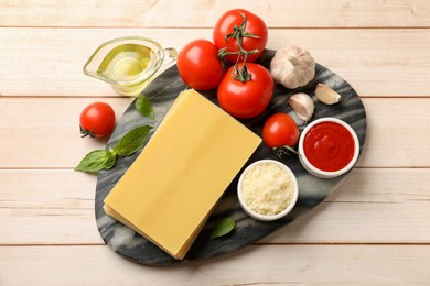 Photo of Ingredients for lasagna on white wooden table, flat lay