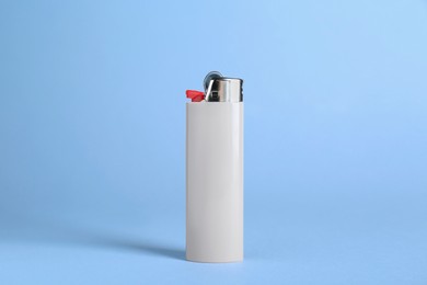 Stylish small pocket lighter on white background