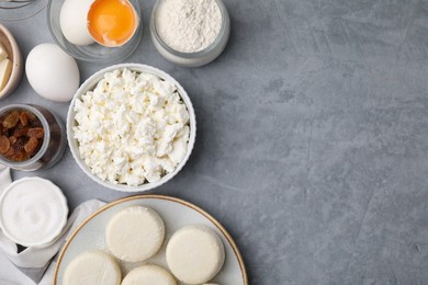 Photo of Uncooked cottage cheese pancakes and different ingredients on light grey table, flat lay. Space for text