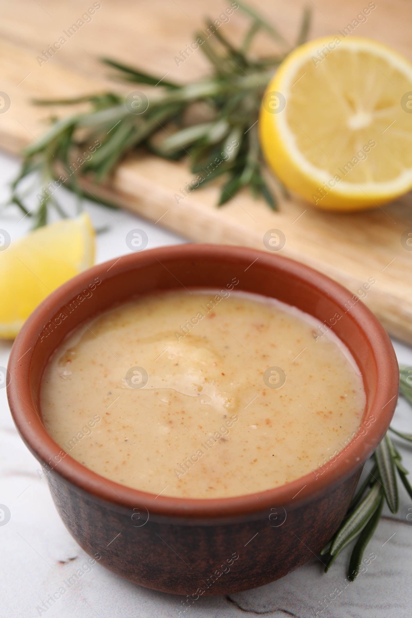 Photo of Delicious turkey gravy in bowl on table, closeup