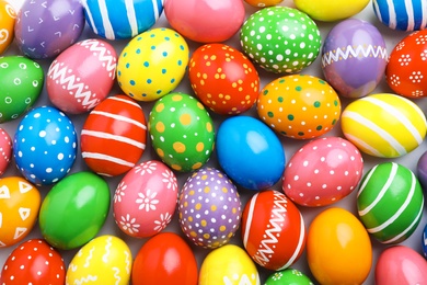 Photo of Many decorated Easter eggs as background, top view. Festive tradition