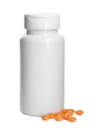 Bottle with vitamin pills isolated on white