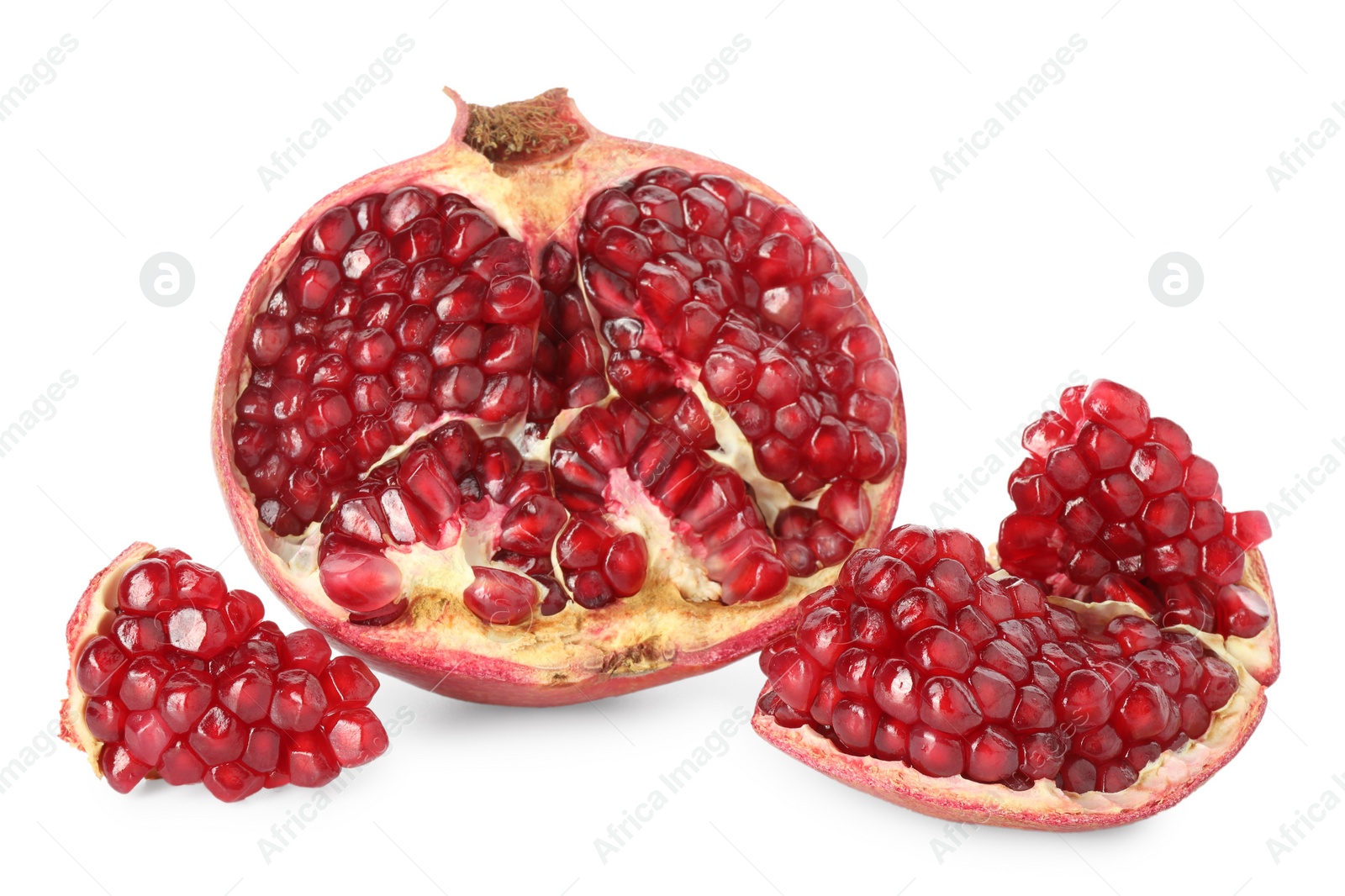 Photo of Fresh cut pomegranate with juicy seeds isolated on white