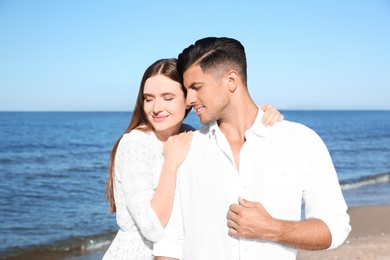 Lovely couple together on beach. Summer vacation