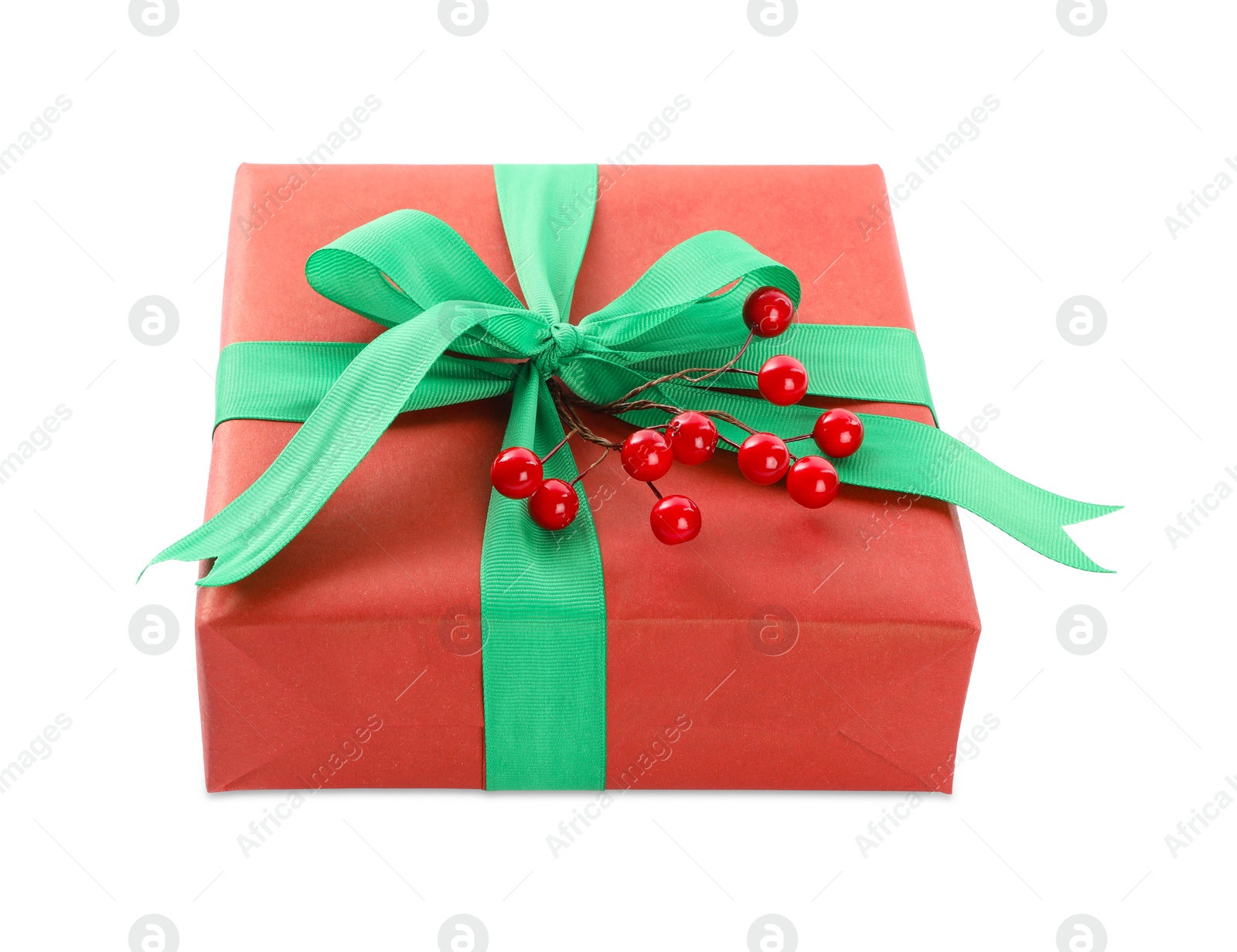 Photo of Christmas gift box decorated with green bow and berries isolated on white
