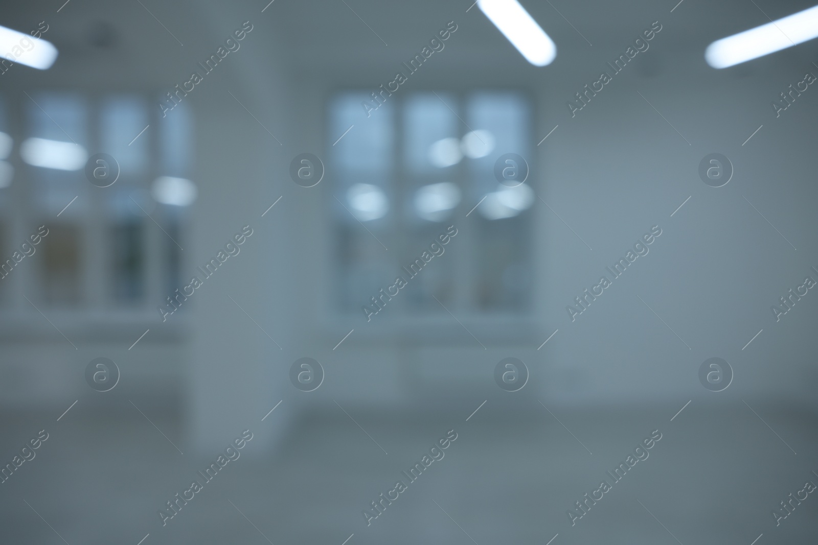 Photo of Blurred view of new empty room with windows