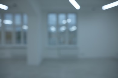 Photo of Blurred view of new empty room with windows