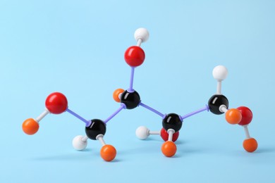 Photo of Molecule of sugar on light blue background. Chemical model