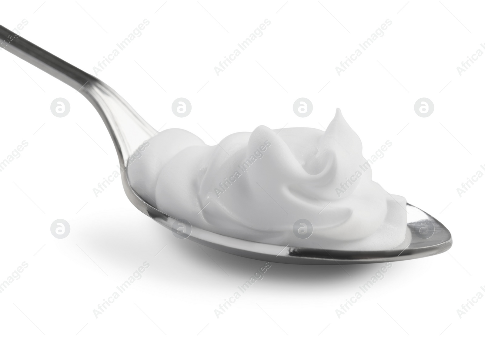 Photo of Silver spoon with sour cream isolated on white