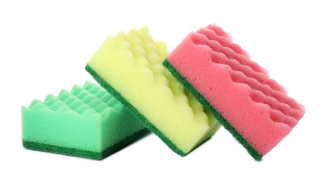 Photo of Bright cleaning sponges with abrasive scourers on white background