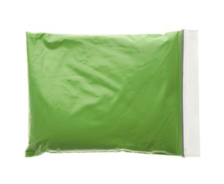 Photo of Green powder in plastic bag isolated on white, top view. Holi festival celebration