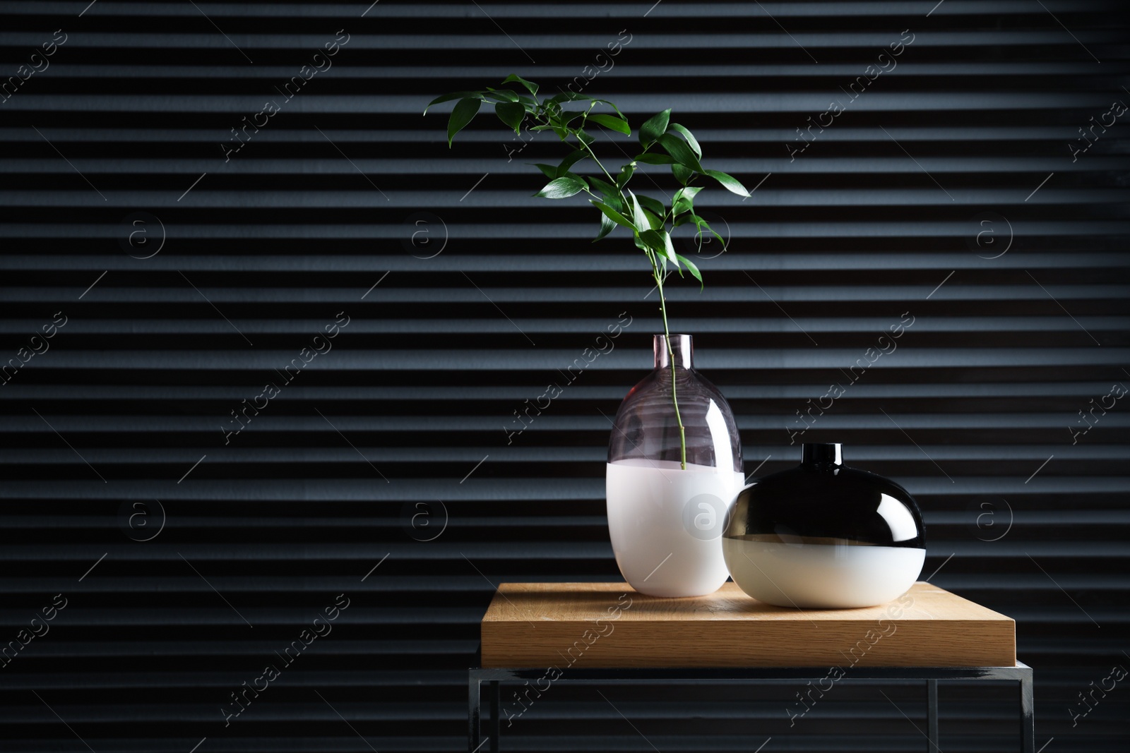 Photo of Stylish decorative vases on table, space for text