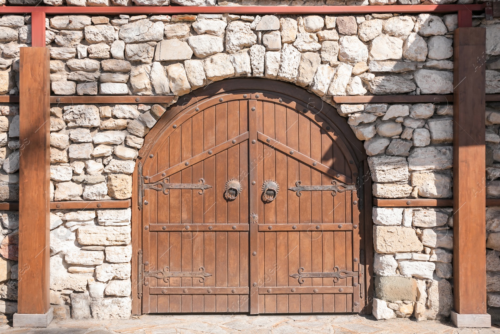 Photo of Entrance of house with beautiful old wooden gates