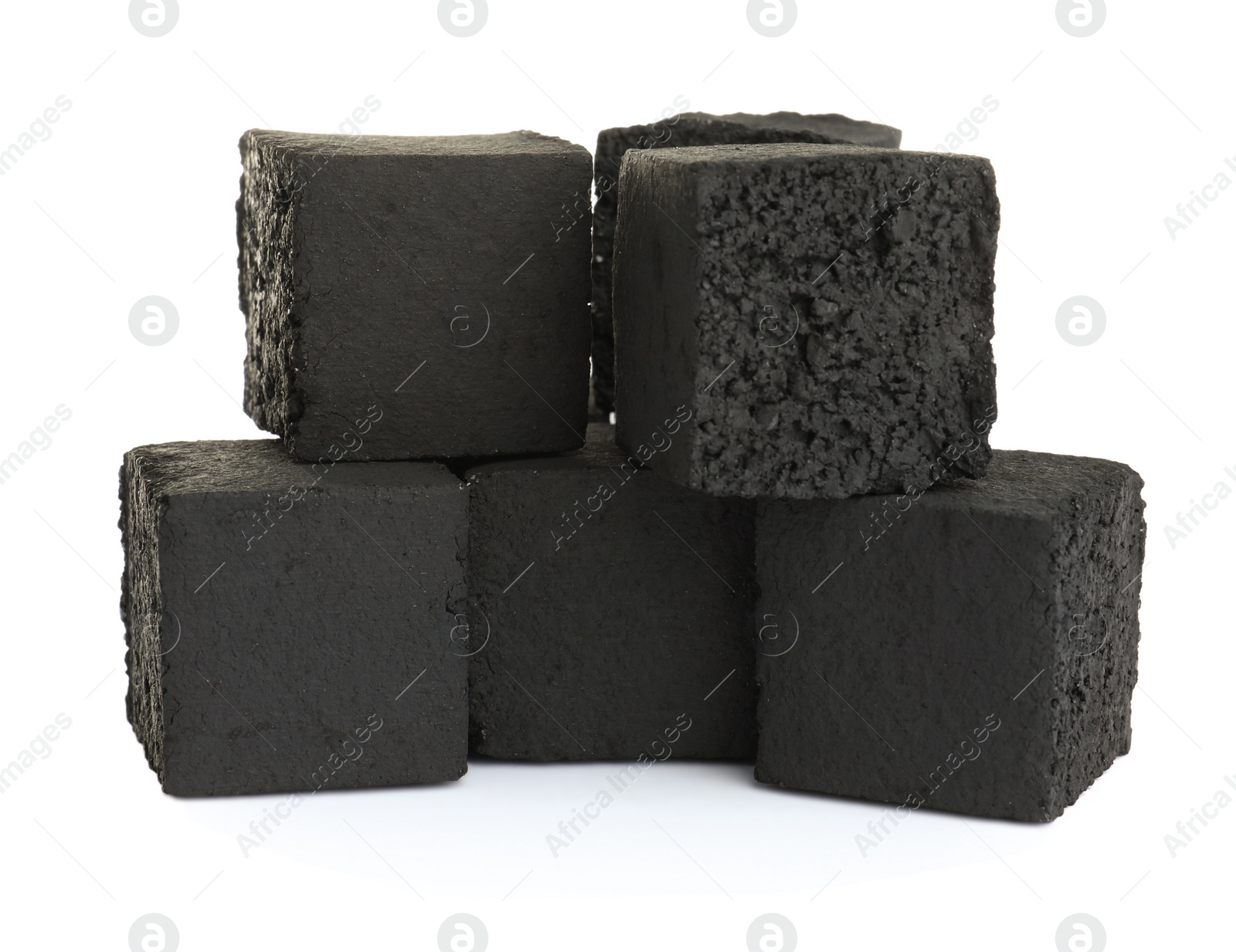 Photo of Stack of charcoal cubes for hookah on white background