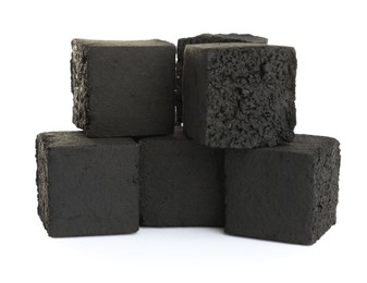 Stack of charcoal cubes for hookah on white background