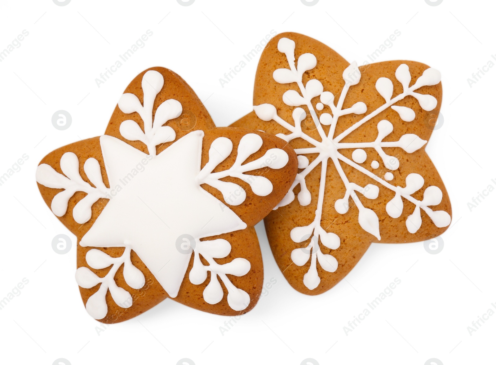 Photo of Tasty star shaped Christmas cookies with icing isolated on white, top view