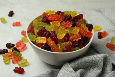 Photo of Delicious gummy bear candies on light table
