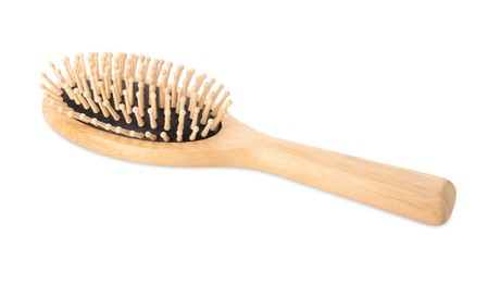 Photo of One new wooden hairbrush isolated on white