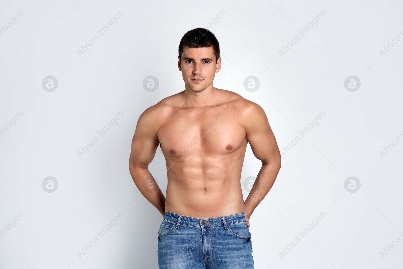 Photo of Man with sexy body on light background