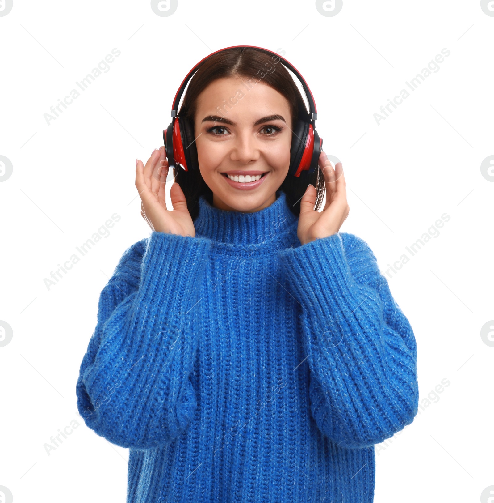 Photo of Young woman listening to music with headphones on white background