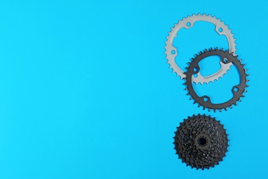 Set of different bicycle parts on color background, flat lay. Space for text