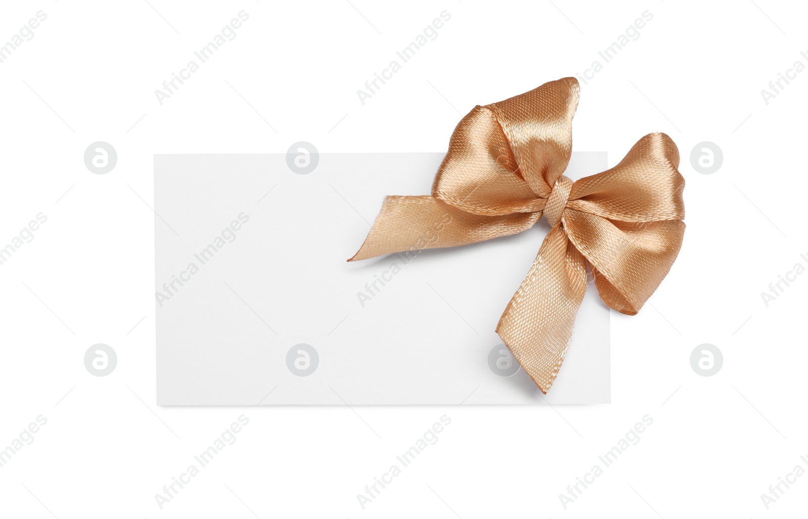 Photo of Blank gift card with golden bow isolated on white, top view