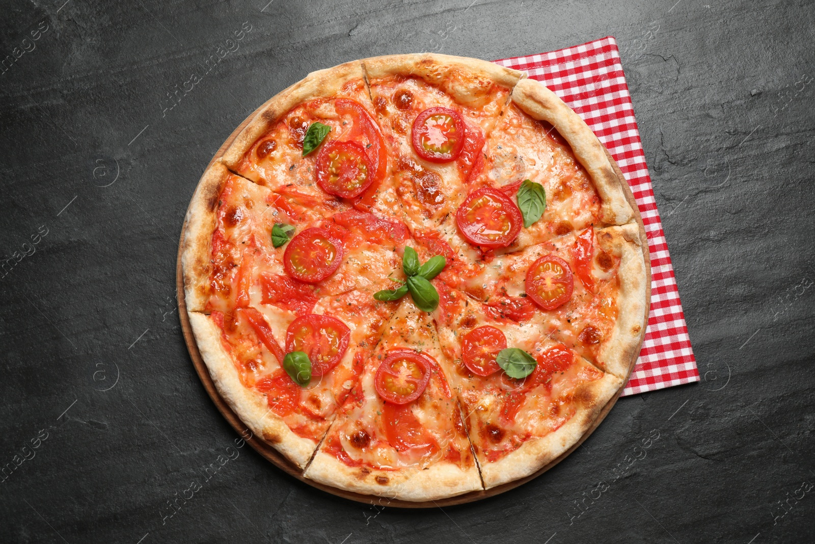 Photo of Delicious pizza Margherita on dark grey table, top view