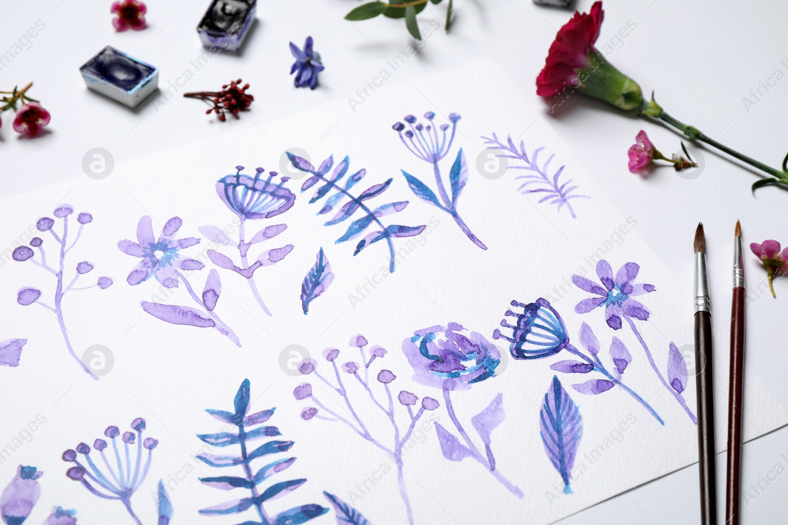 Photo of Composition with floral picture and watercolor paints on white background