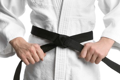 Photo of Karate coach wearing kimono and black belt on white background, closeup