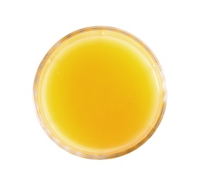 Photo of Glass of orange juice on white background, top view