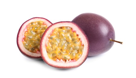 Photo of Cut and whole passion fruits isolated on white