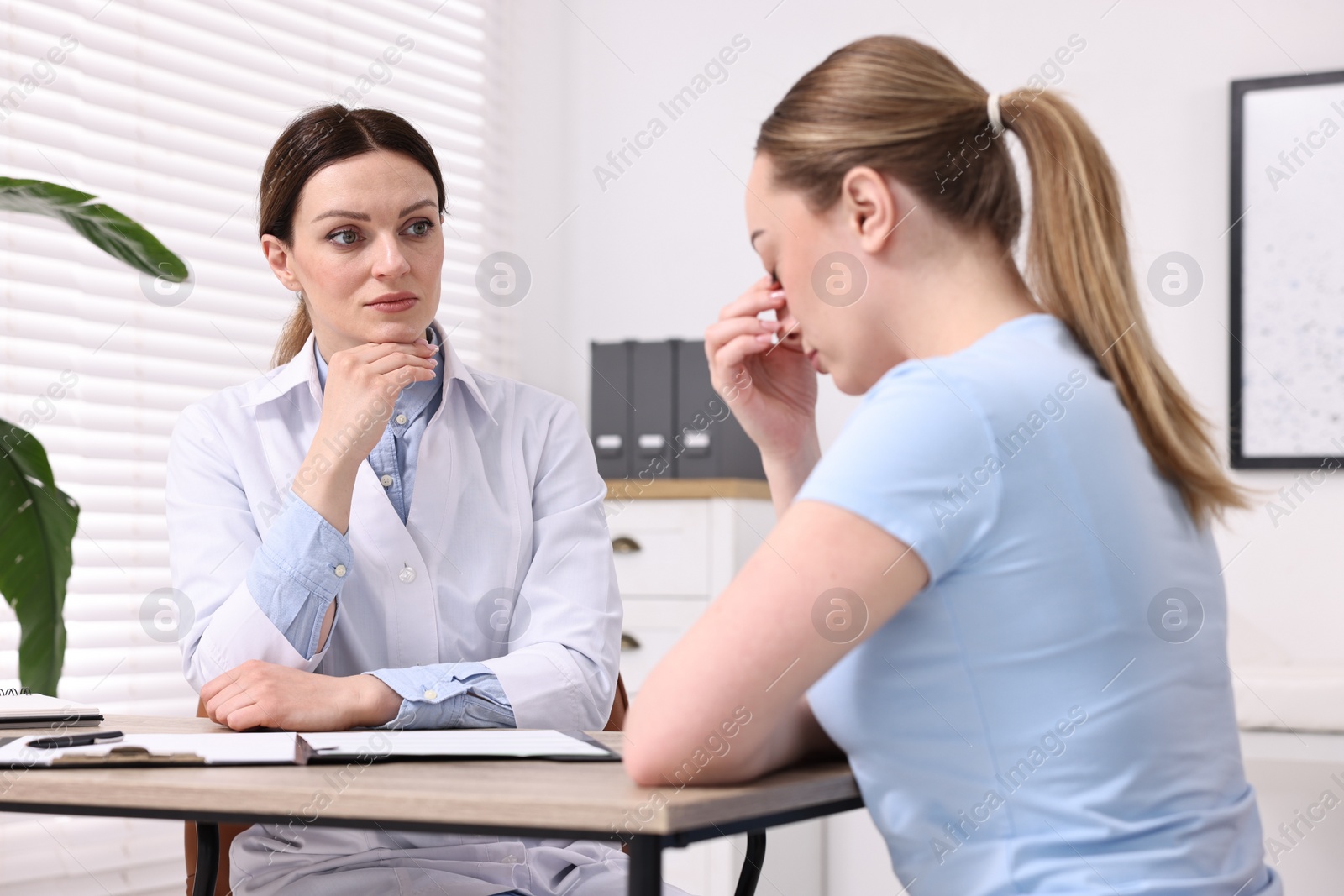 Photo of Mammologist's appointment. Doctor and woman in hospital