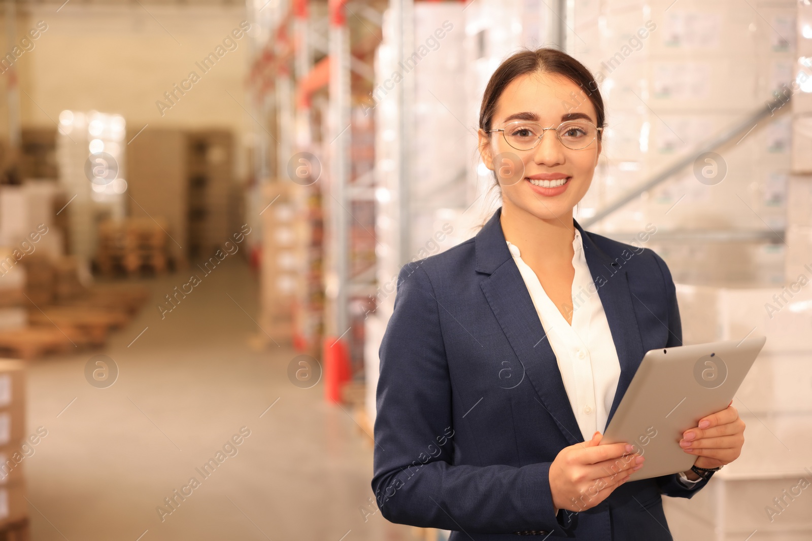 Image of Manager with tablet working at warehouse. Logistics center