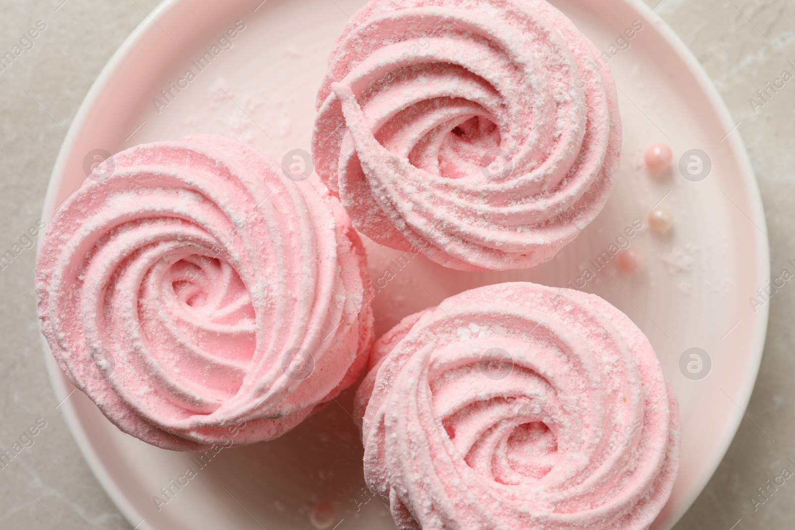 Photo of Delicious pink marshmallows on light grey table, top view