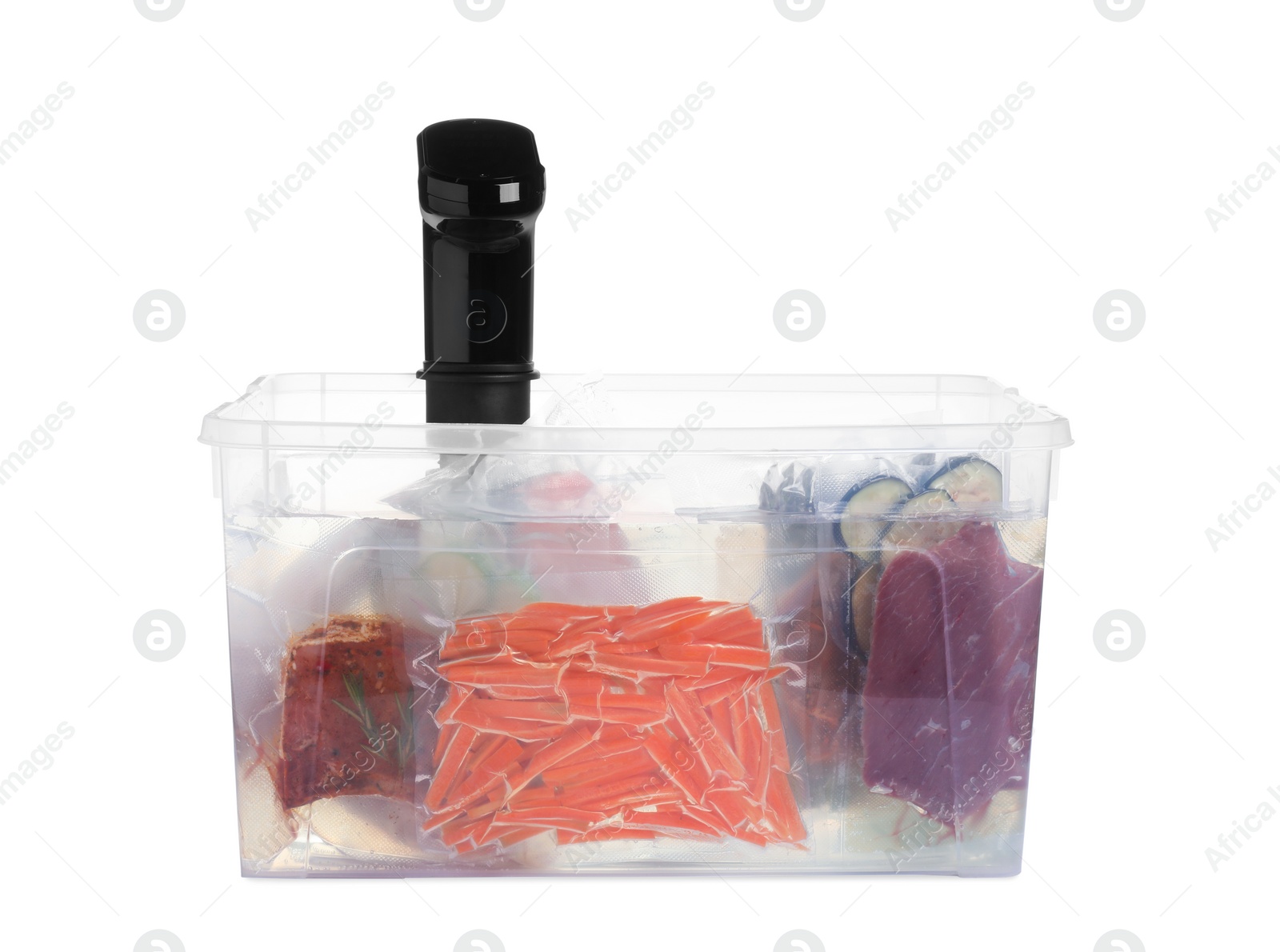 Photo of Sous vide cooker and vacuum packed food products in box isolated on white. Thermal immersion circulator